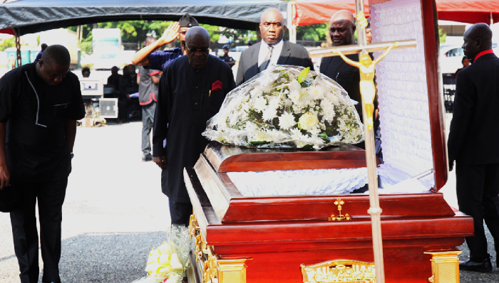 Mr Edward Doe Adjaho ( left), the Speaker of Parliament, and some MPS paying their last respects to the late Mr Peter Wiafe Pepera at the forecourt of Parliament House in Accra.